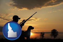 idaho map icon and a hunter and a dog at sunset