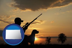 north-dakota map icon and a hunter and a dog at sunset