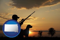 south-dakota map icon and a hunter and a dog at sunset