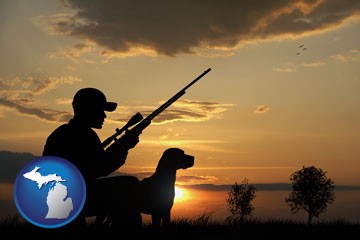 a hunter and a dog at sunset - with Michigan icon