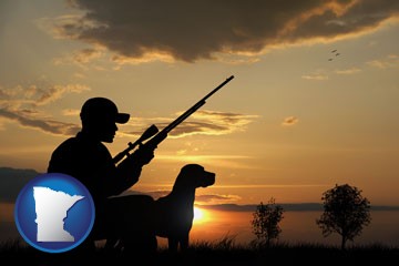 a hunter and a dog at sunset - with Minnesota icon