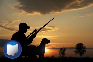 a hunter and a dog at sunset - with Ohio icon