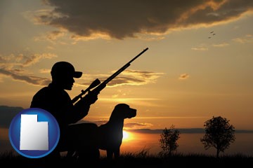 a hunter and a dog at sunset - with Utah icon